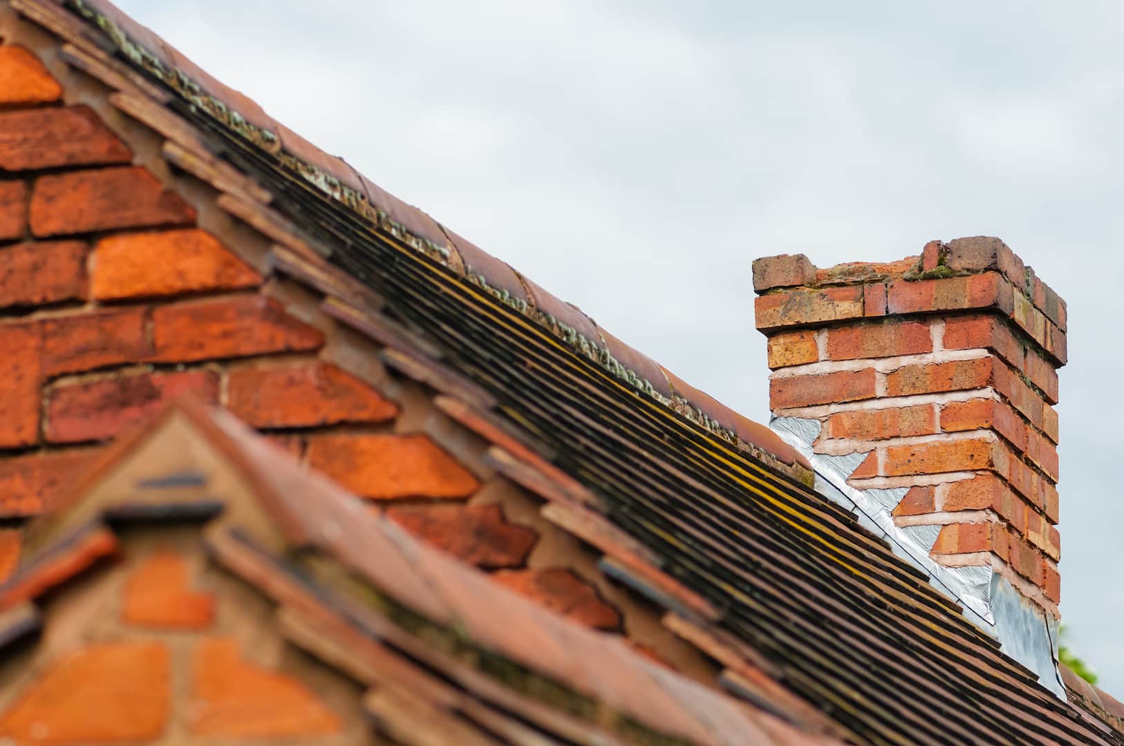 Damaged masonry needs repair old rooftop building exterior