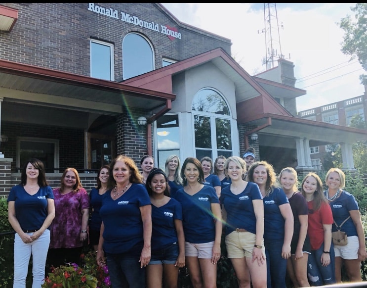 Ferguson Roofing team standing in front of Ronald McDonald house.
