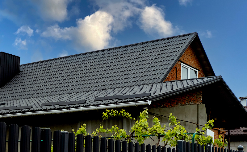 Side view of residential home with low slope roof bitumen.